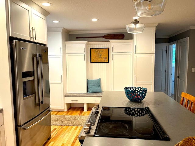 114 Bay View Rd, Otter Tail Twp, MN 56571 - kitchen featuring high end fridge, cooktop, light wood-style floors, crown molding, and white cabinetry