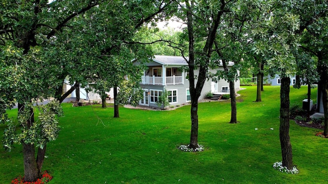 114 Bay View Rd, Otter Tail Twp, MN 56571 - view of green lawn with a balcony