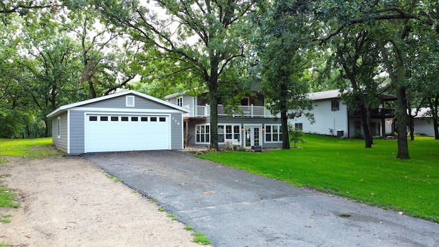 114 Bay View Rd, Otter Tail Twp, MN 56571 - view of front of home featuring a front lawn, a balcony, and a garage
