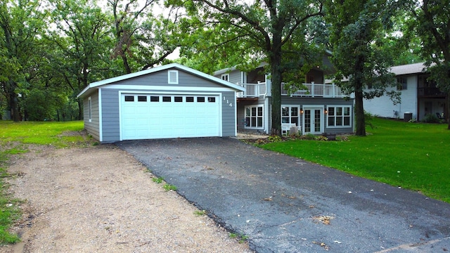 114 Bay View Rd, Otter Tail Twp, MN 56571 - view of front facade with a front yard, french doors, central air condition unit, and a balcony
