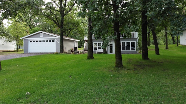 114 Bay View Rd, Otter Tail Twp, MN 56571 - view of front of property with a garage, an outbuilding, and a front lawn