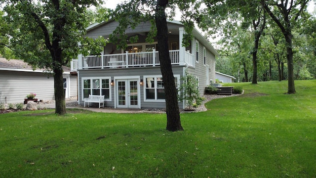 114 Bay View Rd, Otter Tail Twp, MN 56571 - rear view of house featuring french doors, a yard, and a balcony