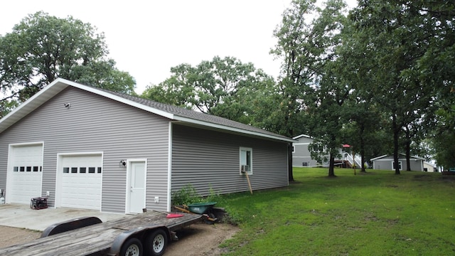 114 Bay View Rd, Otter Tail Twp, MN 56571 - view of side of property with a detached garage and a yard