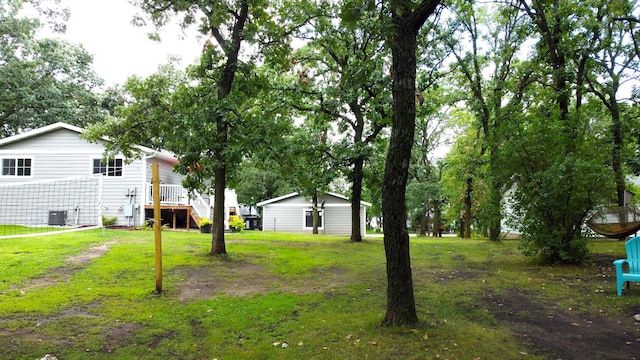 114 Bay View Rd, Otter Tail Twp, MN 56571 - view of grassy yard with central AC
