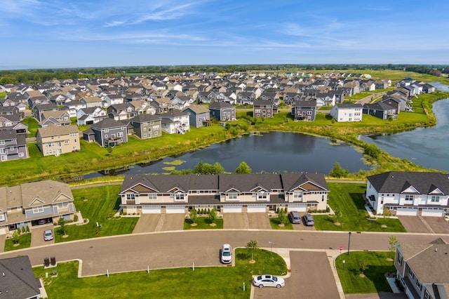 drone / aerial view with a residential view and a water view