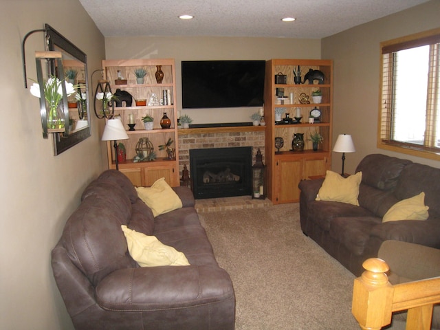 living area featuring recessed lighting, carpet, a fireplace, and a textured ceiling