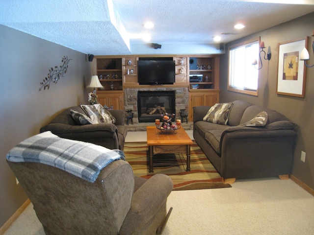 carpeted living room featuring a fireplace, a textured ceiling, and baseboards