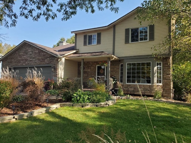 traditional-style home featuring a garage, a front lawn, a porch, and stone siding