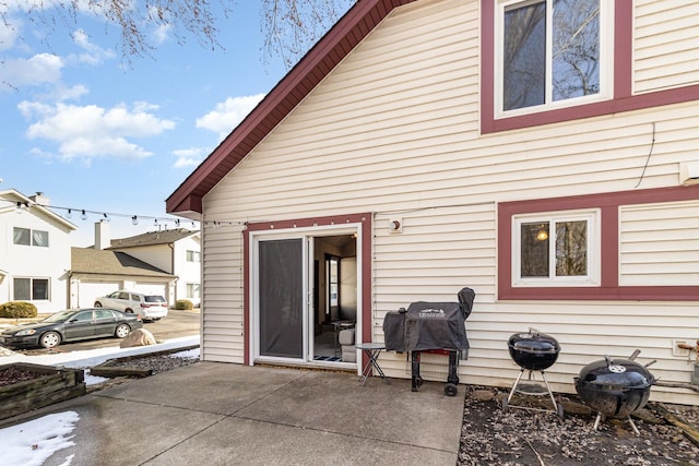 rear view of property featuring a patio