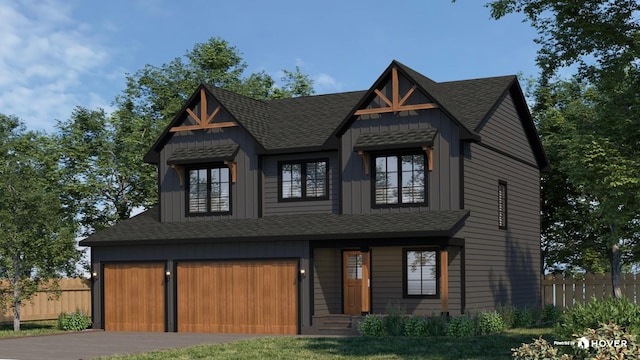 view of front of property with an attached garage, fence, and a shingled roof