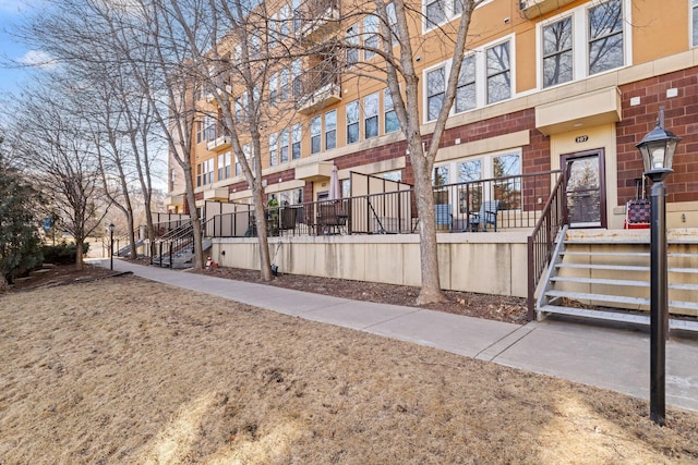 exterior space featuring brick siding