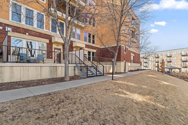 exterior space featuring brick siding