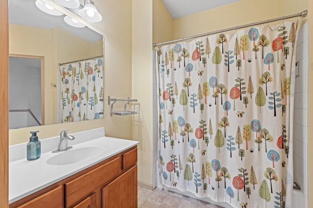 bathroom featuring vanity and a shower with shower curtain