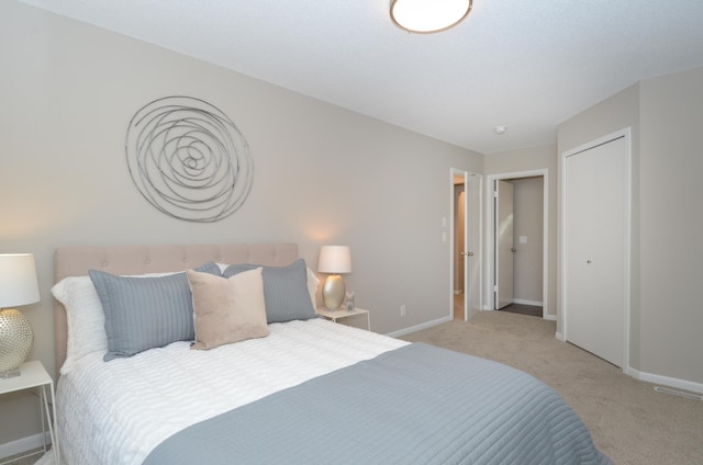 carpeted bedroom with baseboards