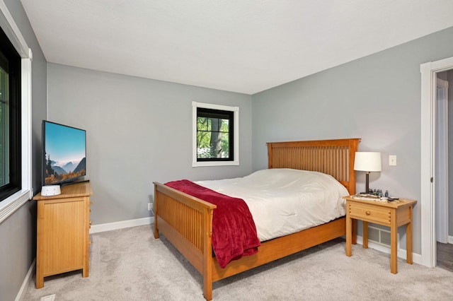 carpeted bedroom with baseboards