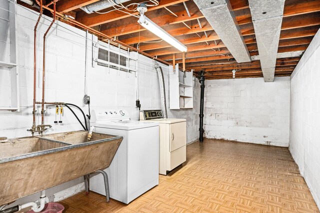 laundry room featuring a sink, washer and dryer, and laundry area