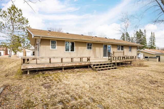 back of house with a wooden deck