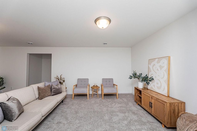 living room with baseboards and light carpet