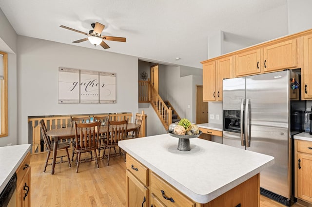 kitchen with light countertops, a ceiling fan, light wood-type flooring, and stainless steel appliances