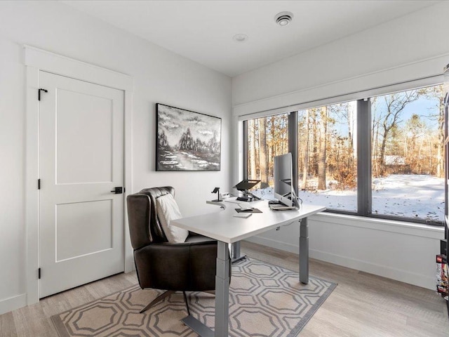 office featuring light wood-style floors and baseboards