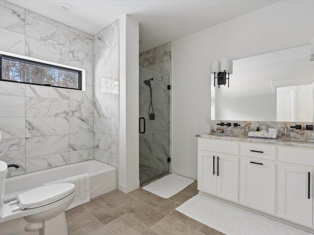 full bathroom with double vanity, a shower stall, toilet, and a tub