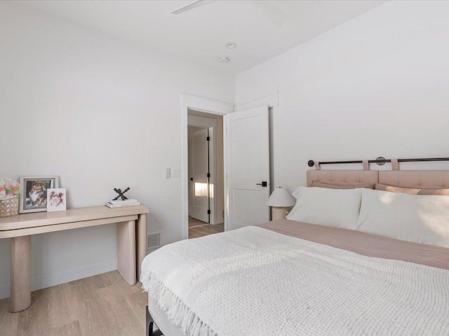 bedroom with visible vents and light wood-style flooring