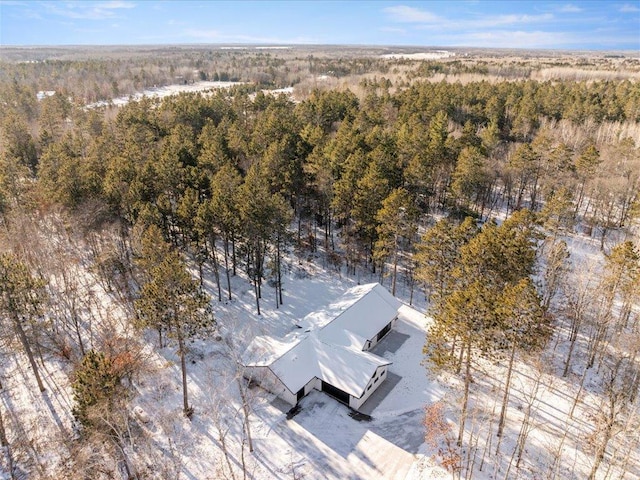 drone / aerial view with a view of trees