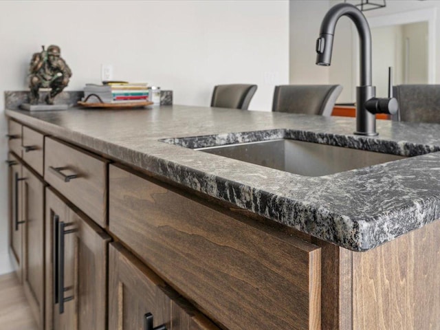 1555 Redstone Trl SW, Loon Lake Twp, MN 56472 - interior details with a sink and dark stone countertops