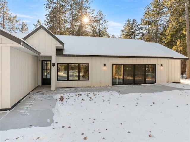 1555 Redstone Trl SW, Loon Lake Twp, MN 56472 - snow covered property featuring board and batten siding