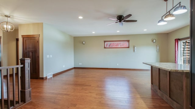 kitchen featuring recessed lighting, visible vents, light wood-style flooring, and baseboards