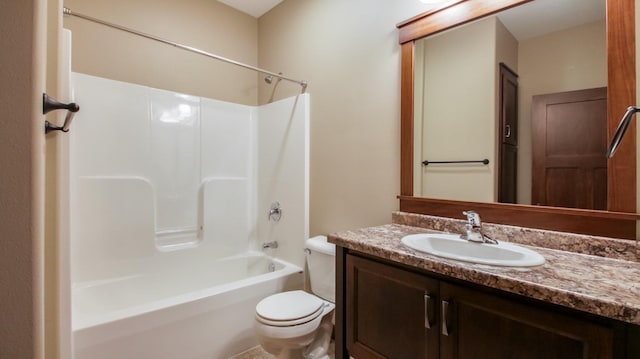 bathroom featuring tub / shower combination, toilet, and vanity