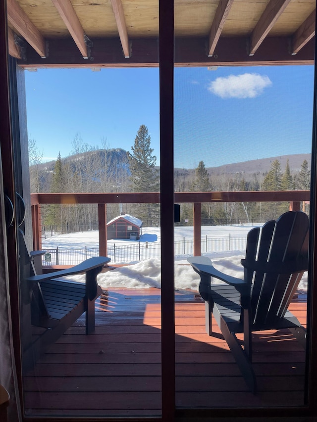 wooden deck with a mountain view