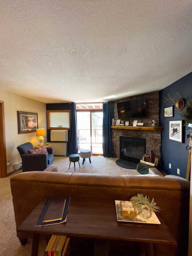 carpeted living area with a stone fireplace and a textured ceiling