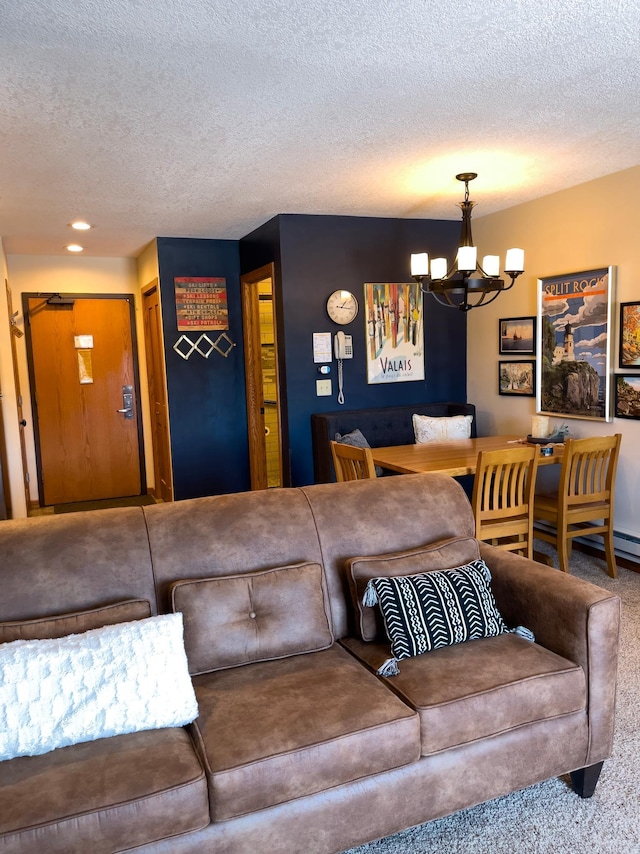 carpeted living room with a chandelier, recessed lighting, and a textured ceiling