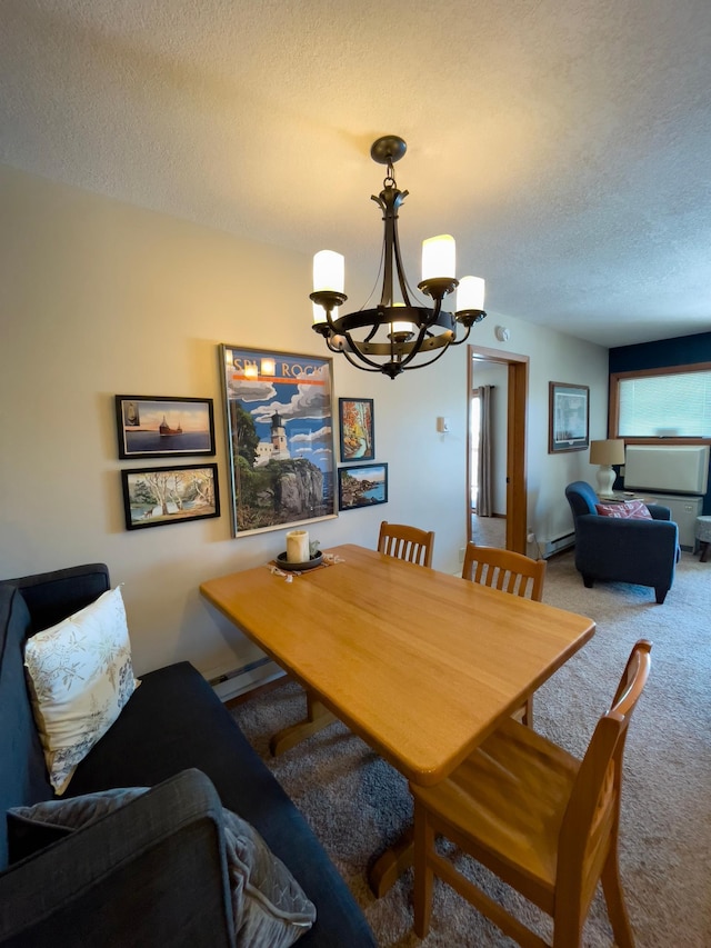 dining room with a chandelier, carpet flooring, a textured ceiling, and a baseboard radiator