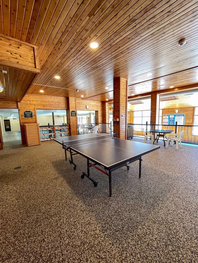 game room featuring wooden ceiling, recessed lighting, carpet, and wood walls