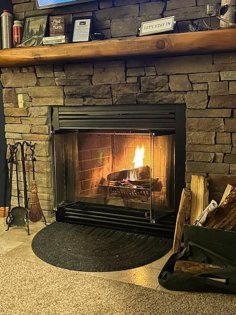 room details with a stone fireplace