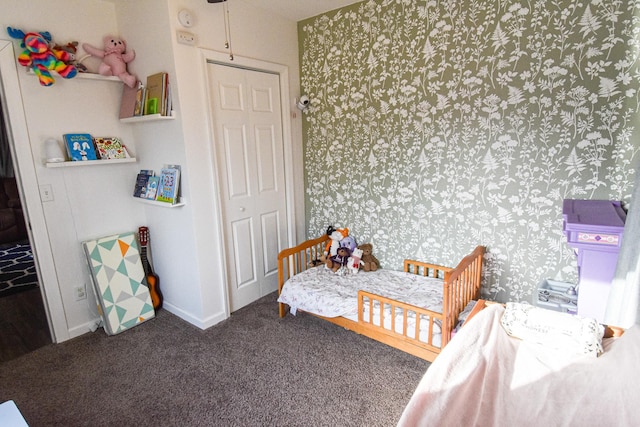 carpeted bedroom featuring wallpapered walls and baseboards