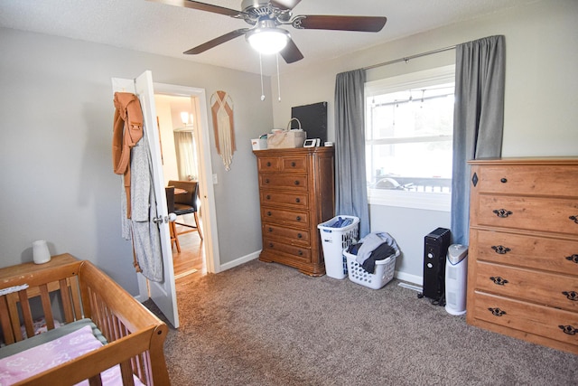 carpeted bedroom featuring ceiling fan and baseboards