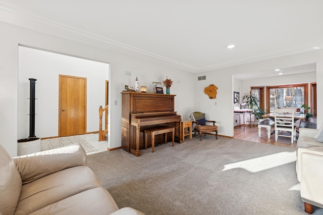 living area with recessed lighting, carpet, visible vents, and baseboards