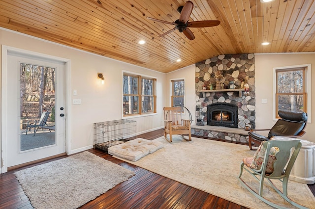 living room with baseboards, wood ceiling, lofted ceiling, a fireplace, and hardwood / wood-style flooring