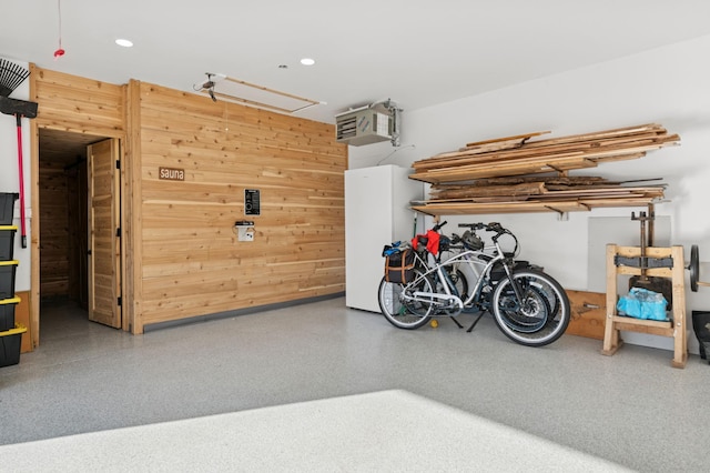 garage with wooden walls and recessed lighting