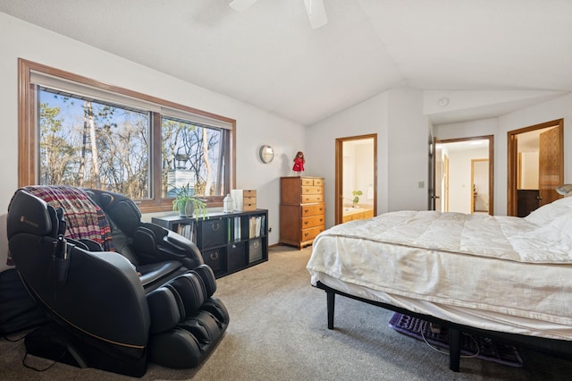 bedroom with vaulted ceiling, carpet flooring, a ceiling fan, and ensuite bathroom