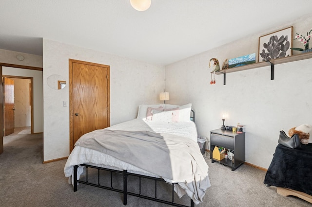 bedroom with baseboards and light carpet