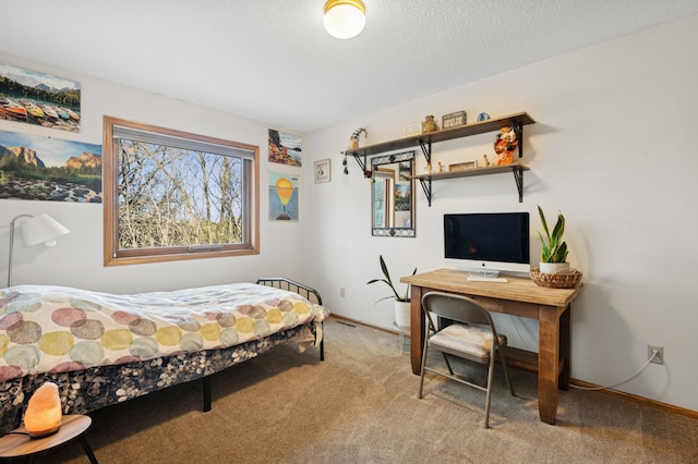 bedroom featuring a textured ceiling, baseboards, and carpet floors