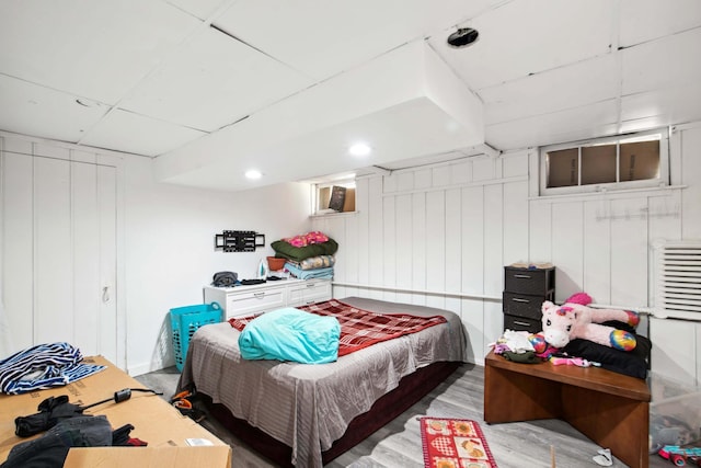 bedroom with wood finished floors