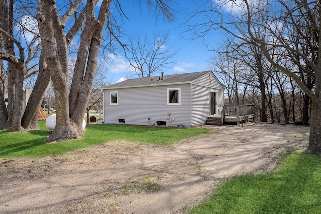 back of property featuring a yard, a deck, central air condition unit, and dirt driveway