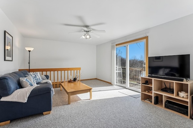 carpeted living room with baseboards and ceiling fan