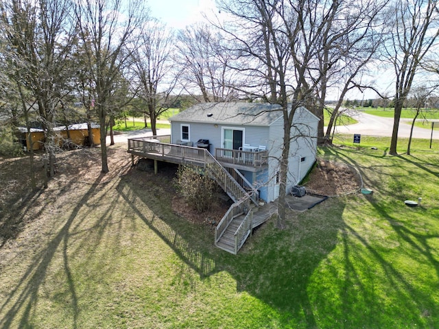 view of yard with stairway and a wooden deck