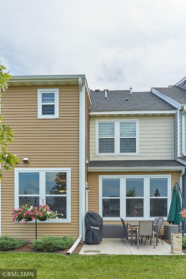 back of property featuring a patio